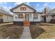 Charming bungalow featuring fresh exterior paint and a tidy front yard at 729 W 32Nd St, Indianapolis, IN 46208