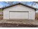 Spacious detached garage with a white door, offering ample storage or parking at 729 W 32Nd St, Indianapolis, IN 46208