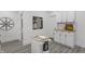 Well-lit kitchen featuring white cabinetry, butcher block countertops, and a mobile island at 729 W 32Nd St, Indianapolis, IN 46208