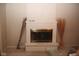 Interior view of fireplace with white brick and brass firebox at 7625 E 35Th St, Indianapolis, IN 46226