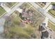 Aerial view of a well-manicured backyard, patio and landscaping in a desirable neighborhood at 7806 Ashtree Dr, Indianapolis, IN 46259