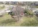 Aerial view of a beautiful backyard with lush green grass and mature trees, offering privacy and shade at 7806 Ashtree Dr, Indianapolis, IN 46259