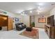 Relaxing basement area with comfortable seating, a media console, and neutral carpeting for a cozy atmosphere at 7806 Ashtree Dr, Indianapolis, IN 46259