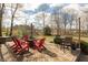 Charming outdoor patio featuring a brick surface, comfortable seating, and a fire pit for cozy gatherings at 7806 Ashtree Dr, Indianapolis, IN 46259