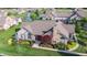 Aerial view showcasing the home's landscaping and community pond with water feature at 7914 King Post Dr, Indianapolis, IN 46237