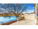 Waterfront backyard with a serene lake view, patio, and lush landscaping; great for outdoor living and entertaining at 7914 King Post Dr, Indianapolis, IN 46237