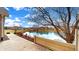 A picturesque view from the back of the property, showcasing a serene pond and well-maintained surroundings at 7914 King Post Dr, Indianapolis, IN 46237