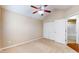 Bedroom featuring a ceiling fan, closet, and neutral walls, offering a comfortable and versatile space at 7914 King Post Dr, Indianapolis, IN 46237