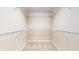 Spacious walk-in closet with built-in wire shelving providing ample storage space for clothes and accessories at 7914 King Post Dr, Indianapolis, IN 46237