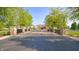 Welcoming entrance to the property with stone pillars, manicured landscaping, and a paved driveway at 7914 King Post Dr, Indianapolis, IN 46237