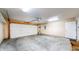 Spacious garage with ample room for parking and storage, equipped with an automatic door opener at 7914 King Post Dr, Indianapolis, IN 46237