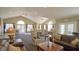 Bright community center living area with vaulted ceilings and plenty of comfortable seating at 7914 King Post Dr, Indianapolis, IN 46237