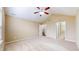 Bright and spacious main bedroom featuring neutral carpet and a ceiling fan at 7914 King Post Dr, Indianapolis, IN 46237
