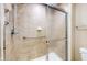 Tiled shower with glass door and grab bar at 7914 King Post Dr, Indianapolis, IN 46237