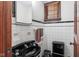 Powder room featuring black fixtures, tile, and unique design at 906 Franklin St, Columbus, IN 47201