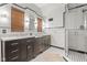 Modern bathroom featuring dual sinks, marble counters, and a glass-enclosed shower at 906 Franklin St, Columbus, IN 47201