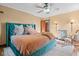 Stylish bedroom with bed, lamp, rug and seat with decoratively appointed with pillows and linens at 906 Franklin St, Columbus, IN 47201
