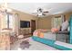 Bedroom featuring a ceiling fan and television with bed and natural light from windows at 906 Franklin St, Columbus, IN 47201