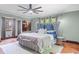 Spacious bedroom with a plush bed, calming decor, and plenty of natural light at 906 Franklin St, Columbus, IN 47201