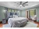 Stylish bedroom with a large bed, ample natural light, and comfortable seating at 906 Franklin St, Columbus, IN 47201