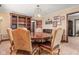 Elegant dining room with wood table, seating for four, and unique wall decor at 906 Franklin St, Columbus, IN 47201