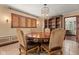 Formal dining area featuring a wood table, shelving, and a decorative light fixture at 906 Franklin St, Columbus, IN 47201