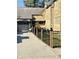 Lovely stone home featuring a patio setup, flower decorations, and a spacious driveway at 906 Franklin St, Columbus, IN 47201