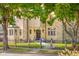 Beautiful stone home with well-maintained landscaping, offering a glimpse of classic elegance and charm at 906 Franklin St, Columbus, IN 47201