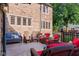 Stone patio with wicker and wooden furniture, perfect for outdoor relaxation at 906 Franklin St, Columbus, IN 47201
