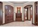Elegant foyer with rich wood trim, tiled floors, and a built-in bench, creating a grand entrance at 906 Franklin St, Columbus, IN 47201