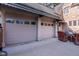 Spacious two-car garage with stone exterior and adjacent patio at 906 Franklin St, Columbus, IN 47201
