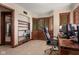 Well-lit office space with custom built-ins, desk, and comfortable desk chair at 906 Franklin St, Columbus, IN 47201
