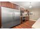 Modern kitchen with stainless steel appliances, wood cabinets, and tile backsplash at 906 Franklin St, Columbus, IN 47201
