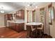 Charming kitchen with wood cabinets, stainless steel appliances, and a cozy breakfast nook at 906 Franklin St, Columbus, IN 47201