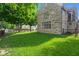 Beautifully maintained lush green lawn surrounds this stone home, creating a serene outdoor space at 906 Franklin St, Columbus, IN 47201