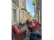 Cozy outdoor patio with red cushioned chairs and a fire pit, perfect for relaxing evenings at 906 Franklin St, Columbus, IN 47201