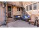 Charming patio area with comfortable seating, stone exterior, and a welcoming entrance at 906 Franklin St, Columbus, IN 47201