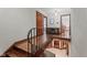 Elegant staircase with wooden steps and black railings, leading to multiple levels at 906 Franklin St, Columbus, IN 47201