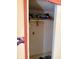 A small walk-in closet with shelving and a hanging rod, suitable for organizing clothes and storage at 911 W 3Rd St, Anderson, IN 46016