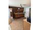 Functional kitchen with stainless steel sink, wooden cabinets, and durable brick accent wall at 911 W 3Rd St, Anderson, IN 46016