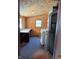 A utility room with a washer, dryer, and utility sink, offering practicality and convenience at 911 W 3Rd St, Anderson, IN 46016