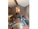 This room features wood paneling, an open doorway, and a variety of storage and workspace options at 911 W 3Rd St, Anderson, IN 46016