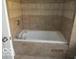 This large bathtub is surrounded by beautiful tile work, perfect for relaxing baths at 929 Gilbert Ave, Indianapolis, IN 46227