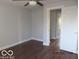 Bedroom with hardwood floors and neutral walls, providing a calm and inviting space at 929 Gilbert Ave, Indianapolis, IN 46227