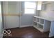 This laundry room features sleek white cabinetry, granite countertops, and plenty of storage solutions at 929 Gilbert Ave, Indianapolis, IN 46227