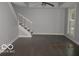 The living room features hardwood floors, tray ceiling and plenty of natural light at 929 Gilbert Ave, Indianapolis, IN 46227