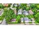 Neighborhood with well-maintained lawns, mature trees, detached garages, and various single-Gathering homes at 960 Cameron St, Indianapolis, IN 46203