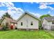 Well-manicured backyard with a view of the rear of the house, excellent for outdoor activities at 960 Cameron St, Indianapolis, IN 46203
