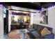 Basement home office/studio with a cozy gray couch and unique decor at 960 Cameron St, Indianapolis, IN 46203