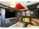 Finished basement with dark walls, home theatre, and fun decor at 960 Cameron St, Indianapolis, IN 46203